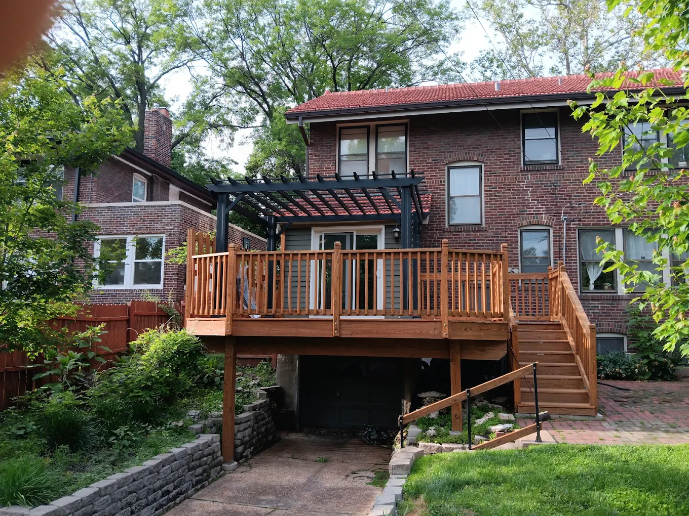 Custom backyard deck with pergola overhead