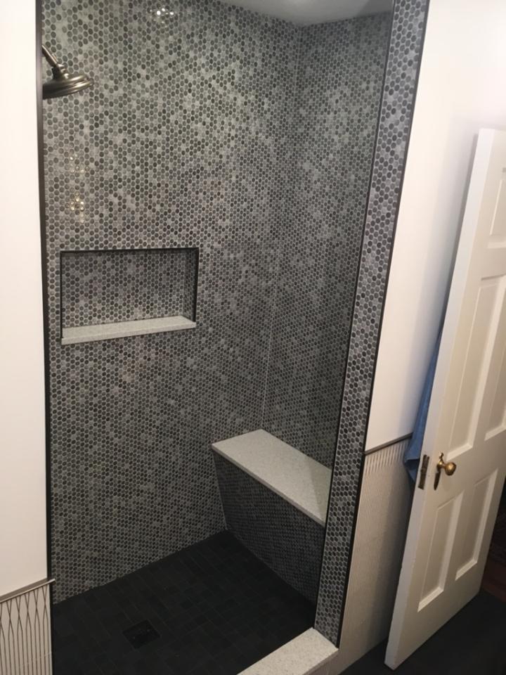 Completed Olivette shower with penny tile walls and recessed niche